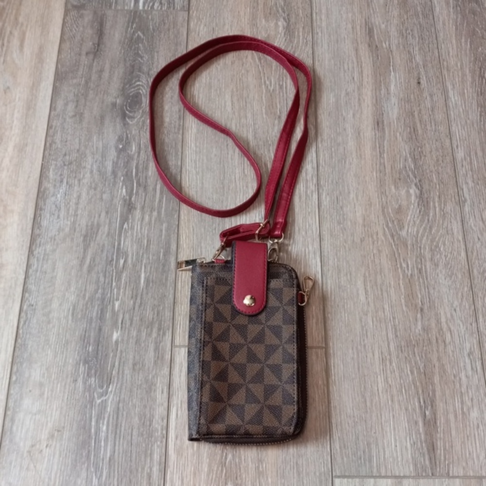 Tan and Brown Wallet With A Crimson Colored Adjustable Strap